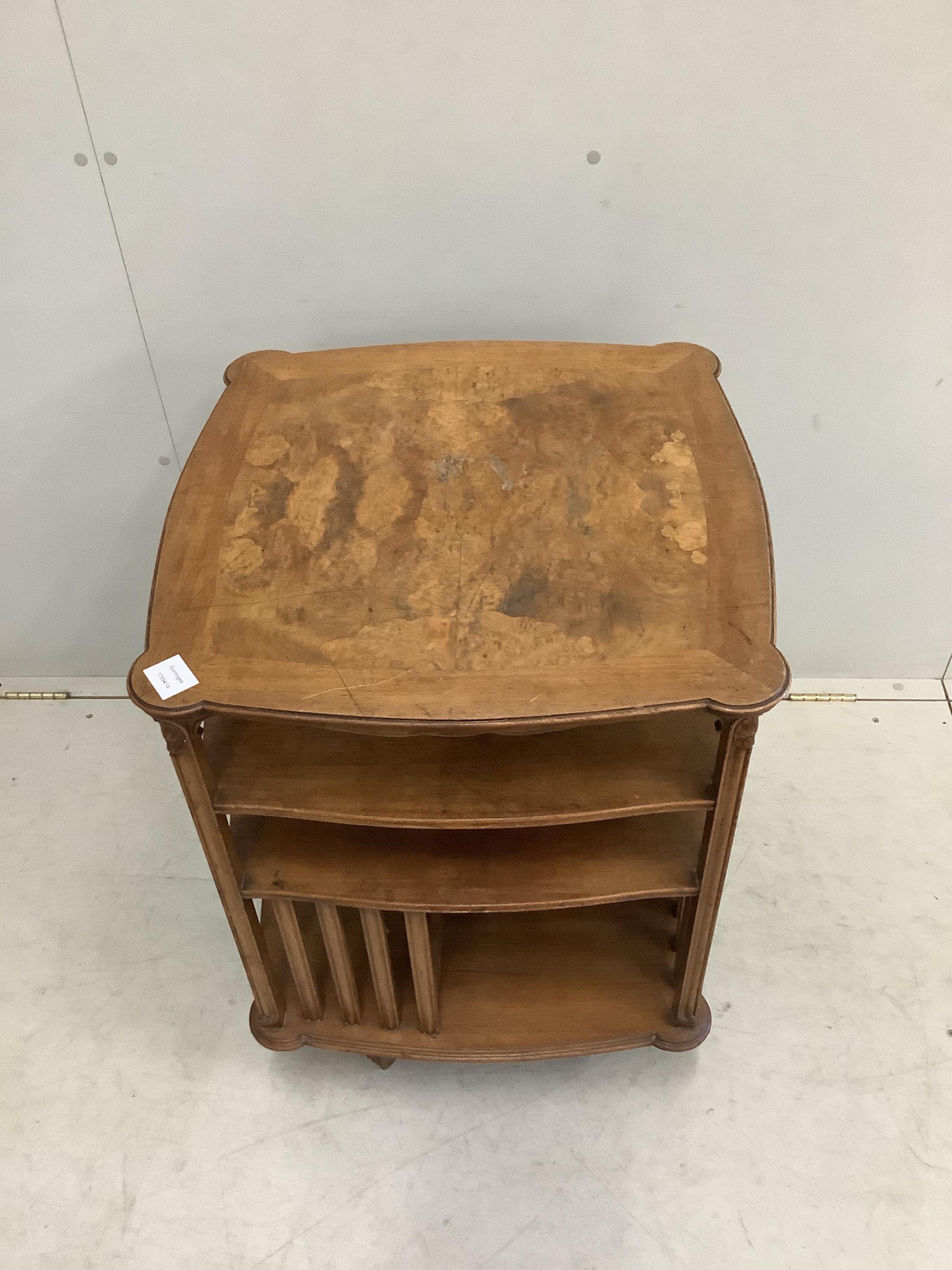 An early 20th century walnut revolving bookcase, width 57cm, height 80cm